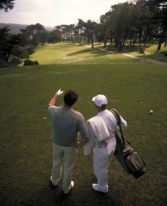 caddie and golfer
